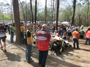 Archers observe an Outdoor Pro Shoot Down event while waiting their turn to compete.