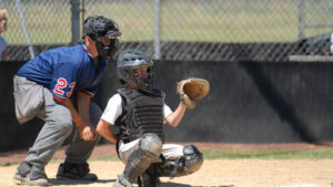 Getty Images A photo of an umpire behind a Little League Baseball catcher