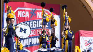 A number male and female cheerleaders from the University of Michigan. 