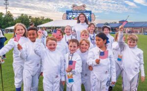 Youth competitors celebrate after a Fencing League of America event at Truist Stadium.