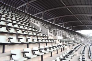 A photo of seats in an empty stadium. 