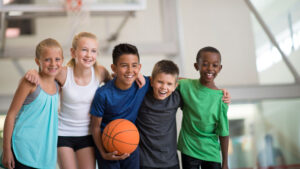 Courtesy Getty Images A group of children enjoying a game of basketball.