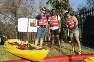 Anthony Rathbun/Courtesy Buffalo Bayou Partnership A group of friends pose before a kayaking event.