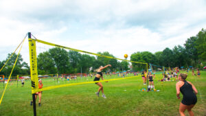 Courtesy Valley Forge Tourism & Convention Board A female player performs a spike during a game of grass volleyball.
