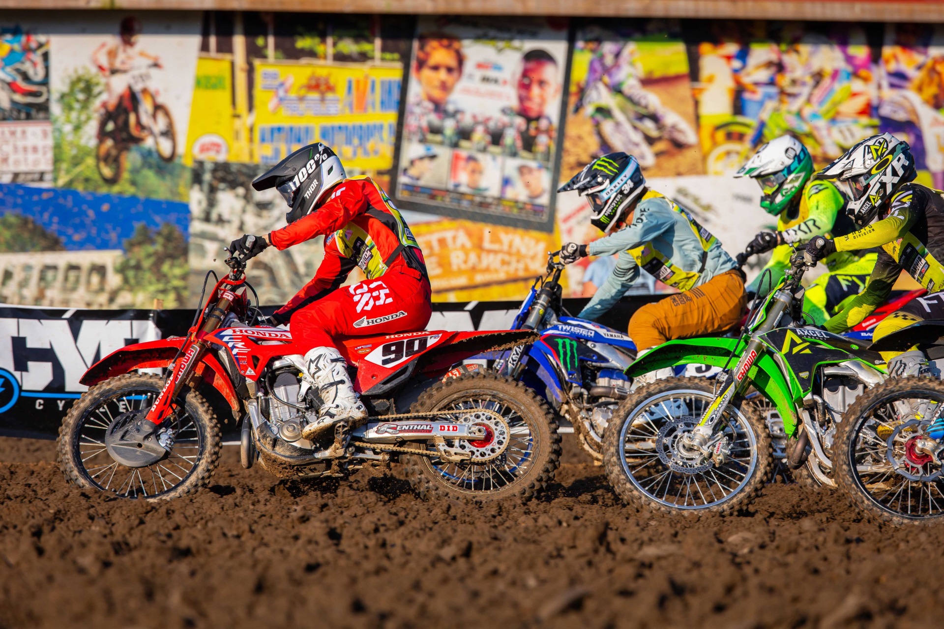 A rider fights for position during competition at the 2024 Monster Energy AMA Amateur National Motocross Championship, held at Loretta Lynn Ranch in Tennessee.