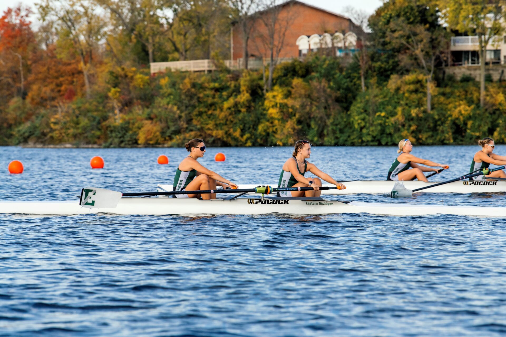 People rowing on the lake.