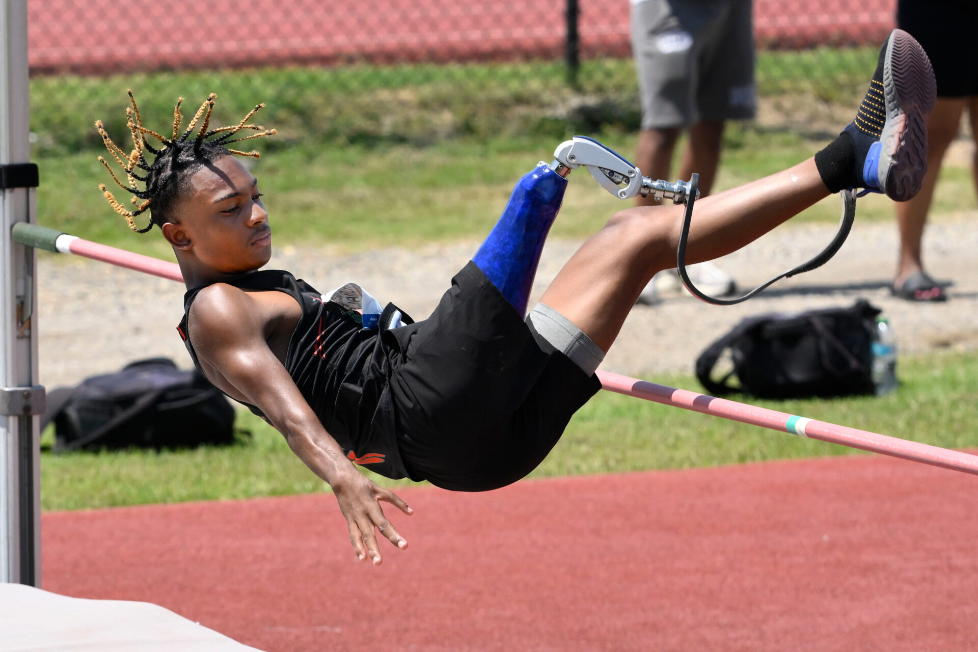 A para athlete doing a high jump.