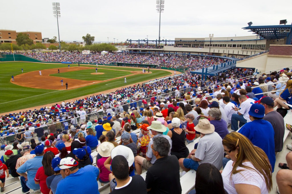 Spectators watch a baseball game at the Kino Sports Complex.