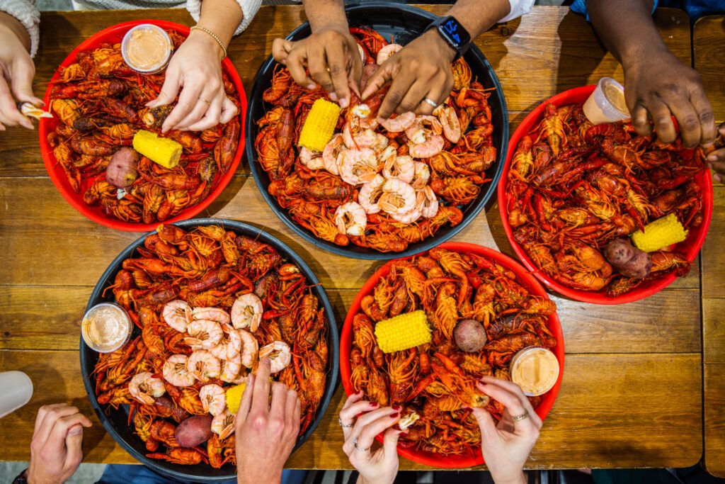 Top down view of plates of Cajun food