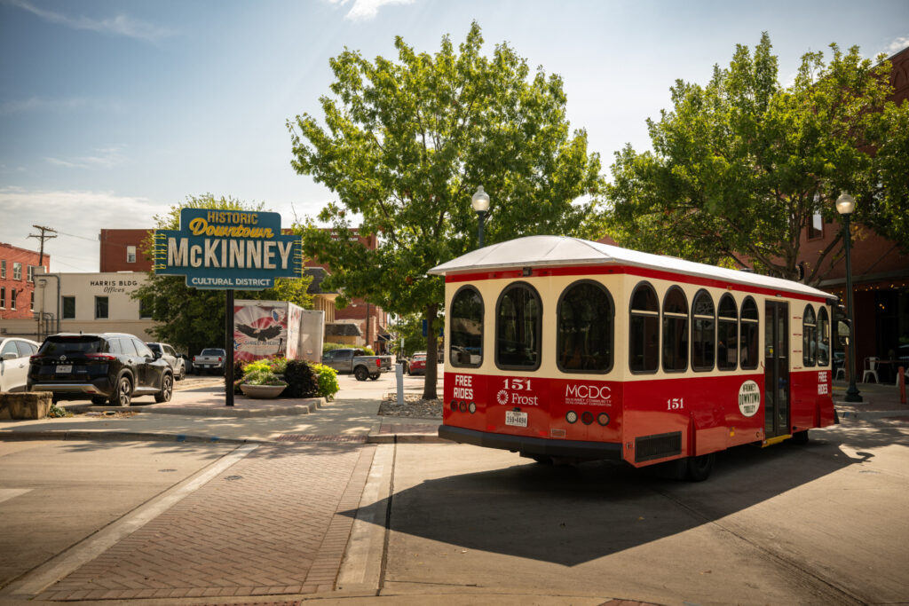 A vintage streetcar rides the tracks in historic downtown McKinney, Texas.